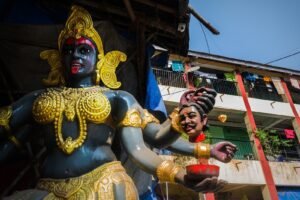 gold and red hindu deity statue